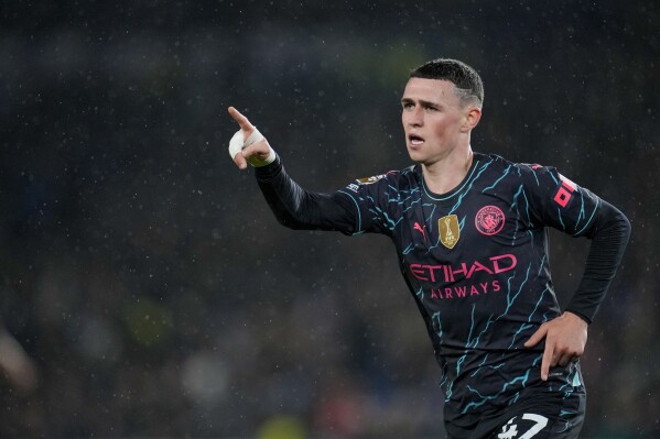 Manchester City's Phil Foden celebrates after scoring his side's third goal during the English Premier League soccer match between Brighton and Manchester City at the Falmer Stadium in Brighton, England, Thursday, April 25, 2024. (AP Photo/Kin Cheung)
