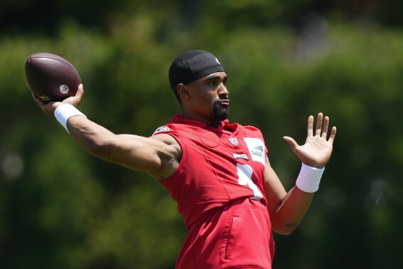 FILE - Philadelphia Eagles quarterback Jalen Hurts takes part in a practice at the NFL football team's training facilities in Philadelphia, Thursday, June 1, 2023. The Eagles are talented and deep on both sides of the ball, though there still are some questions heading into camp. (AP Photo/Matt Rourke, File)