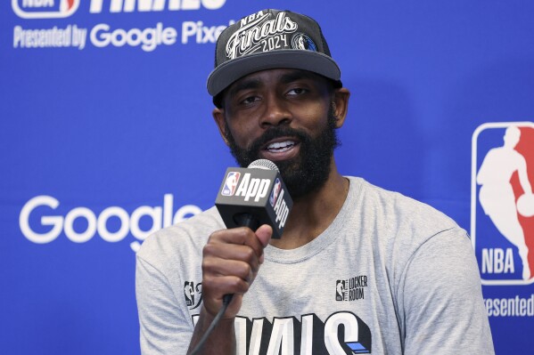Dallas Mavericks guard Kyrie Irving answers questions during a news conference after the Mavericks defeated the Minnesota Timberwolves in Game 5 of the NBA basketball Western Conference finals, Thursday, May 30, 2024, in Minneapolis. (AP Photo/Matt Krohn)