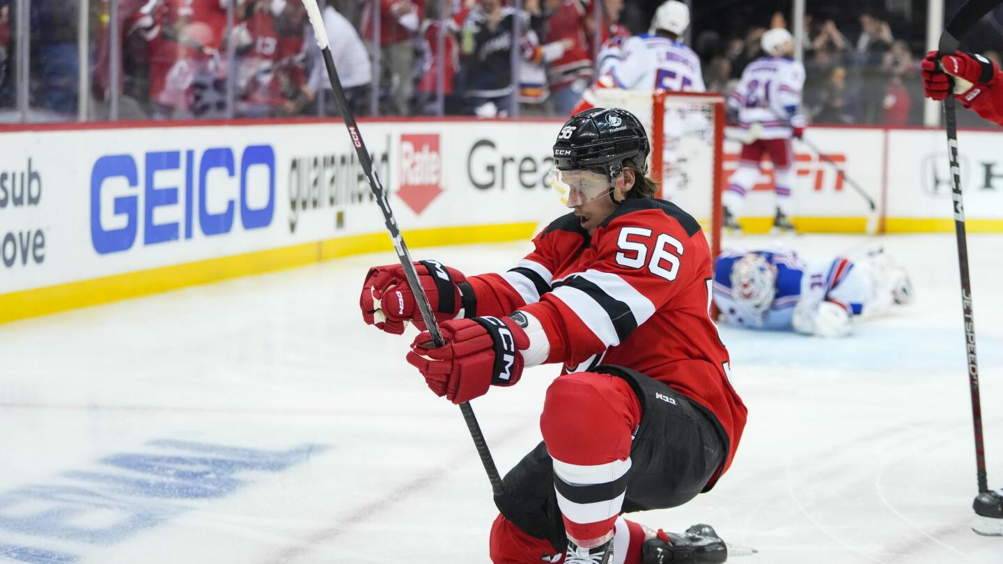 New Jersey Devils' Dawson Mercer (91) celebrates with Erik Haula after  scoring a goal against the New York Rangers during the second period of  Game 5 of an NHL hockey Stanley Cup