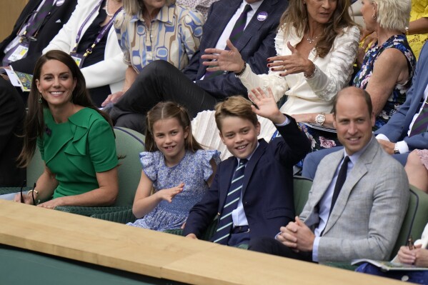 Kate, Princess of Wales, Princess Charlotte, Prince George and Britain's Prince William sit in the Royal Box on Centre Court for the final of the men's singles between Spain's Carlos Alcaraz and Serbia's Novak Djokovic on day fourteen of the Wimbledon tennis championships in London, Sunday, July 16, 2023. (AP Photo/Alastair Grant)