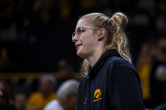 FILE - Iowa Hawkeyes forward Ava Jones (35) looks on during an exhibition game between the Iowa Hawkeyes and the Clarke Pride at Carver-Hawkeye Arena in Iowa City, Iowa on Sunday, Oct. 22, 2023. Jones will take a medical disqualification and retire from college basketball. The school and Jones announced the decision Friday, June 7, 2024, saying Jones would remain on scholarship and work toward her degree at Iowa. (Nick Rohlman/The Gazette via AP, File)