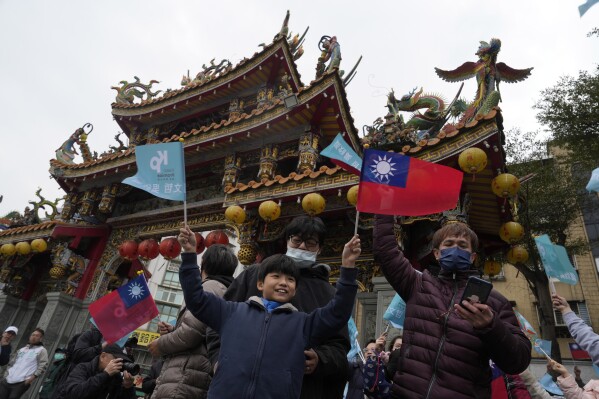 Supporters of Ko Wen-je, Taiwan People's Party (TPP) presidential candidate, wait for his arrival at a temple in New Taipei City, Taiwan on Wednesday, Jan. 10, 2024. Taiwan's elections for president and the 113-member legislature will take place Saturday under intense pressure from China, which makes the outcome important to much of the Asia-Pacific region, as well as to the U.S. (AP Photo/Ng Han Guan)