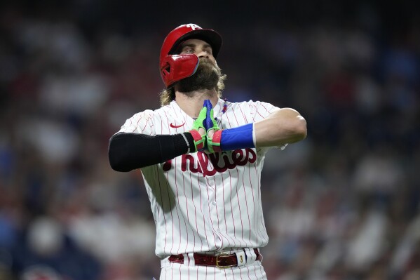 Philadelphia Phillies' Bryce Harper reacts after flying out against St. Louis Cardinals pitcher Miles Mikolas during the fifth inning of a baseball game, Friday, Aug. 25, 2023, in Philadelphia. (AP Photo/Matt Slocum)