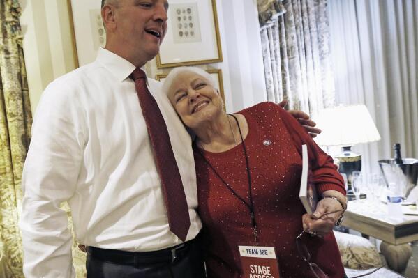 FILE - Louisiana Democratic gubernatorial candidate Rep. John Bel Edwards hugs his mother Dora Jean Edwards as he watches election returns in a hotel suite at his election night watch party in New Orleans, Saturday, Nov. 21, 2015. Dora Jean Edwards, the mother of Louisiana Gov. John Bel Edwards, has died, the governor announced in a Friday, Jan. 20, 2023. (AP Photo/Gerald Herbert, File)