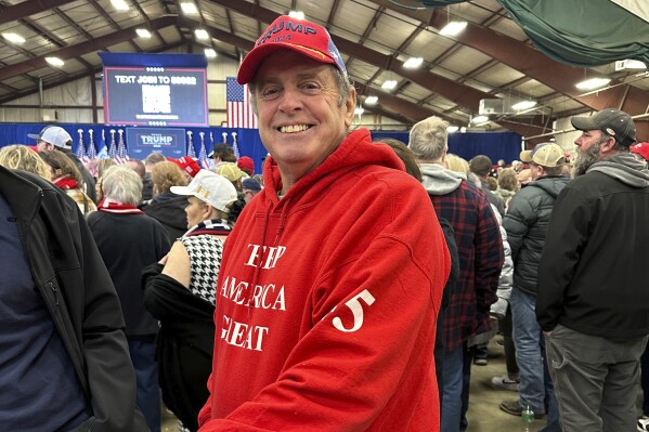 Greg Jennings poses for a photo before a rally for Republican presidential candidate former President Donald Trump in Mason City, Iowa, on Jan. 5, 2024. "At this stage, if we're going to continually lose elections because of that issue, I'd say dump the whole damn thing and let God be the judge," said Jennings, a 68-year-old retired painting contractor from Clear Lake, Iowa. (AP Photo/Steve Peoples)