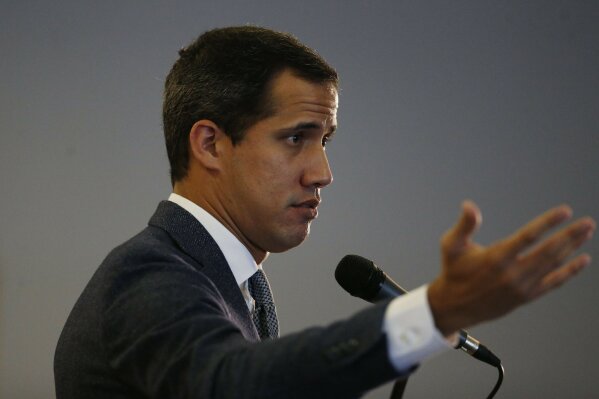 Venezuela's National Assembly President and self proclaimed interim President Juan Guaido speaks during a press conference in Caracas, Venezuela, Wednesday, August 21, 2019.  Guaido on Wednesday cast doubt on President Nicolas Maduro's claim that he is overseeing secret talks with the United States, saying it only reflects disarray within the Venezuelan government. (AP Photo/Leonardo Fernandez)