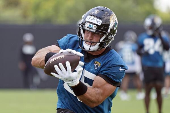 Jacksonville Jaguars tight end Tim Tebow catches a pass during NFL football practice, Thursday, May 27, 2021, in Jacksonville, Fla. (AP Photo/John Raoux)
