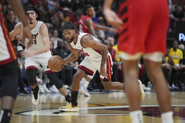 Miami Heat guard Patty Mills (88) brings the ball up the court after stealing a pass against the Portland Trail Blazers during the second half of an NBA basketball game, Friday, March 29, 2024, in Miami. (AP Photo/Jim Rassol)
