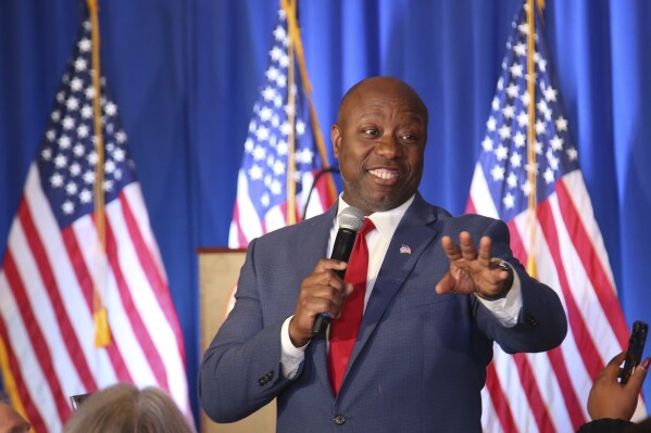 FILE - Republican presidential candidate Tim Scott speaks during the New Hampshire Republican Party's First In The Nation Leadership Summit, Saturday, Oct 14, 2023, in Nashua, N.H. Scott is set to discuss the Israel-Hamas war, U.S. foreign policy and national security at Georgetown University. The Republican presidential candidate is sitting for the conversation at a Monday, Oct. 16, event co-hosted by The Associated Press and Georgetown’s Institute of Politics and Public Service. (AP Photo/Reba Saldanha, File)