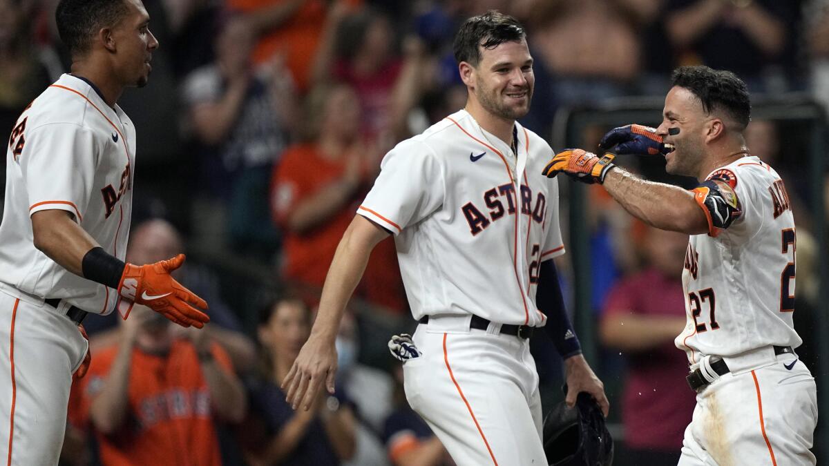 Altuve hits grand slam in 10th, Astros rally past Rangers