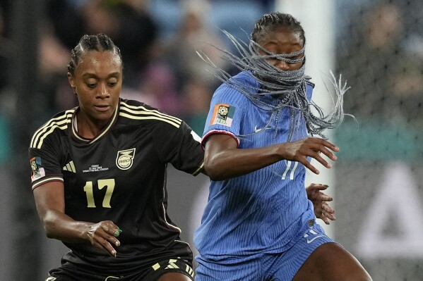 Jamaica's Allyson Swaby, left, challenges France's Kadidiatou Diani during the Women's World Cup Group F soccer match between France and Jamaica at the Sydney Football Stadium in Sydney, Australia, Sunday, July 23, 2023. (AP Photo/Mark Baker)