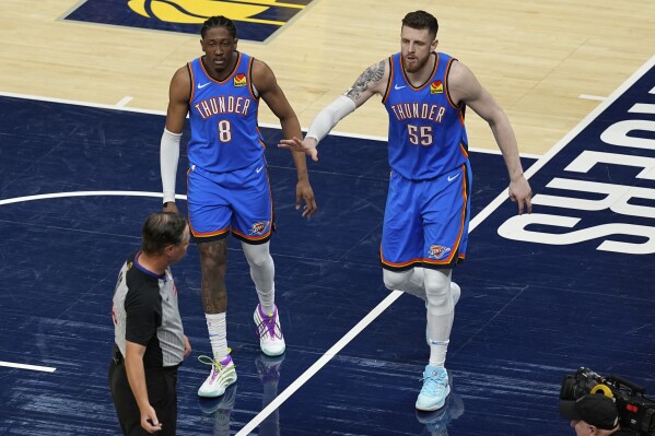 Oklahoma City Thunder center Isaiah Hartenstein (55) and forward Jalen Williams (8) argue a call with the referee during the first half of Game 6 of the NBA Finals basketball series against the Indiana Pacers, Thursday, June 19, 2025, in Indianapolis. (AP Photo/Abbie Parr)