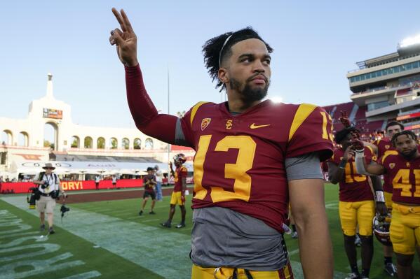Southern California quarterback Caleb Williams (13) celebrates after a 66-14 win over Rice in an NCAA college football game in Los Angeles, Saturday, Sept. 3, 2022. (AP Photo/Ashley Landis)