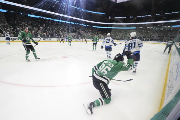 Dallas Stars' Mikko Rantanen (96) celebrates his goal in the third period of Game 3 of a second-round NHL hockey playoff series against the Winnipeg Jets in Dallas, Sunday, May 11, 2025. (AP Photo/Julio Cortez)