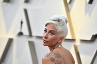 FILE - In this Feb. 24, 2019 file photo, Lady Gaga arrives at the Oscars at the Dolby Theatre in Los Angeles. The market debut of Universal Music Group is a hit with investors optimistic about the future of steaming music. Shares jumped nearly 40% Tuesday, Sept. 21, 2021, to almost $26 per each in trading on the Euronext Amsterdam exchange. Universal has a huge roster of stars including Taylor Swift, Billie Eilish, Lady Gaga, the Beatles and Bob Dylan.   (Photo by Jordan Strauss/Invision/AP, File)