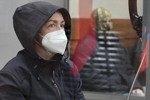 Radio Free Europe-Radio Liberty editor Alsu Kurmasheva sits in a cage in a courtroom in Kazan, Russia, Friday, Oct. 20, 2023. Alsu Kurmasheva is an editor for Radio Free Europe-Radio Liberty. She is the second U.S. journalist to be detained in Russia this year.(Artemii Shumatov/Kommersant Publishing House via AP)