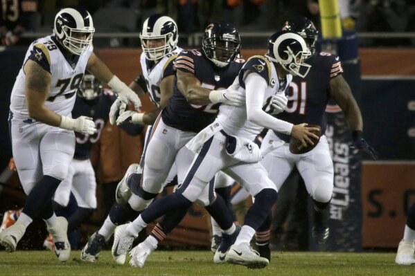 
              Chicago Bears linebacker Khalil Mack (52) pressures Los Angeles Rams quarterback Jared Goff (16) during an NFL football game Sunday, Dec. 9, 2018, in Chicago. (AP Photo/David Banks)
            