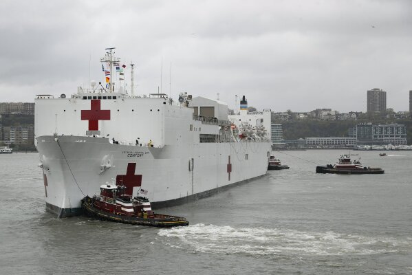 The USNS Naval Hospital Ship Comfort departs via the Hudson River, Thursday, April 30, 2020, in the Manhattan borough of New York. (AP Photo/John Minchillo)