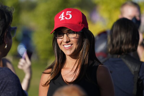 Lauren Boebert, the Republican candidate for the U.S. House of Representatives seat in Colorado's vast 3rd Congressional District, attends a freedom cruise staged by her supporters Friday, Sept. 4, 2020, in Pueblo West, Colo.  Boebert has wasted no time in courting the president, his base and national party leaders in her campaign to keep the seat in GOP hands. (AP Photo/David Zalubowski)