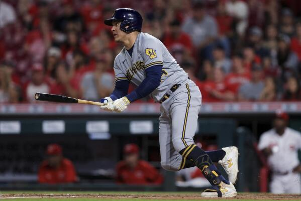 Milwaukee Brewers' Avisail Garcia watches his RBI single during the seventh inning of the team's baseball game against the Cincinnati Reds in Cincinnati, Tuesday, June 8, 2021. (AP Photo/Aaron Doster)
