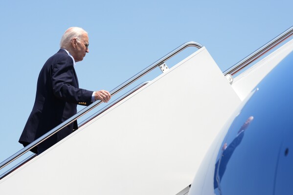 President Joe Biden boards Air Force One at Andrews Air Force Base, Md., as he leaves for a campaign trip to Madison, Wis., Friday, July 5, 2024. (AP Photo/Manuel Balce Ceneta)
