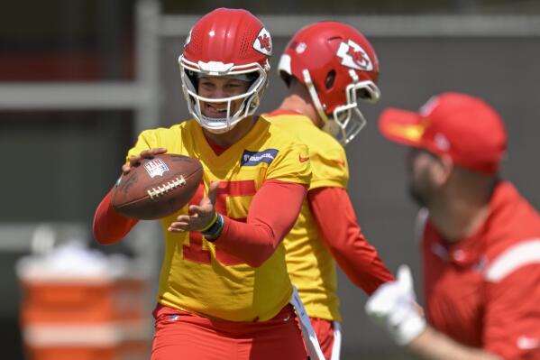 FILE - Kansas City Chiefs quarterback Patrick Mahomes takes a snap during drills at the NFL football team's mandatory minicamp Tuesday, June 14, 2022, in Kansas City, Mo. Patrick Mahomes and Co. could be headed to a fifth straight AFC title game. (AP Photo/Reed Hoffmann, File)