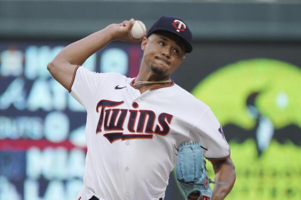 Minnesota Twins pitcher Chris Archer throws against the Texas Rangers in the first inning of a baseball game, Saturday, Aug. 20, 2022, in Minneapolis. (AP Photo/Jim Mone)