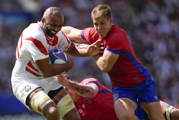 Japan's Michael Leitch, left, attempts to beat Chile's Domingo Saavedra during the Rugby World Cup Pool D match between Japan and Chile at Stadium de Toulouse, Toulouse, France, Sunday, Sept. 10, 2023. (AP Photo/Lewis Joly)