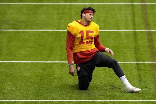 Kansas City Chiefs quarterback Patrick Mahomes stretches during an NFL football workout Wednesday, Jan. 25, 2023, in Kansas City, Mo. The Chiefs are scheduled to play the Cincinnati Bengals Sunday in the AFC championship game. (AP Photo/Charlie Riedel)