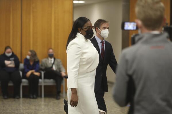 Rochester Mayor Lovely Warren walks towards the courtroom for the start of her trial in Rochester, N.Y., on Monday, Oct. 4, 2021. Warren and two political campaign associates, Rosalind Brooks-Harris and Albert Jones Jr., are charged with breaking campaign finance rules during her 2017 reelection campaign. (Democrat & Chronicle via AP)