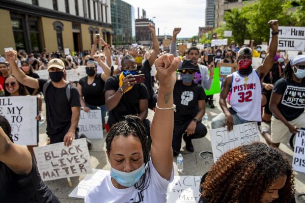 The crowd chants "I can't breathe" during a peaceful protest June 3, 2020, in Grand Rapids, Mich., over the death of George Floyd in Minneapolis. (Cory Morse/The Grand Rapids Press via AP)