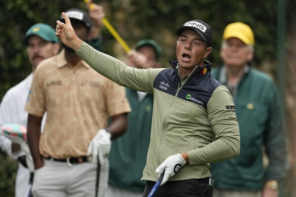 Viktor Hovland, of Norway, points in the direction of his tee shot on the second hole during a practice round in preparation for the Masters golf tournament at Augusta National Golf Club Tuesday, April 9, 2024, in Augusta, Ga. (AP Photo/George Walker IV)