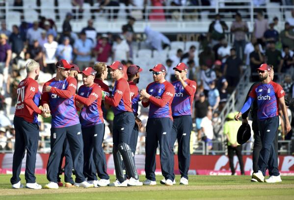 England players celebrate their win in the second Twenty20 international cricket match against Pakistan at Headingley in Leeds, Sunday, July 18, 2021. (AP Photo/Rui Vieira)