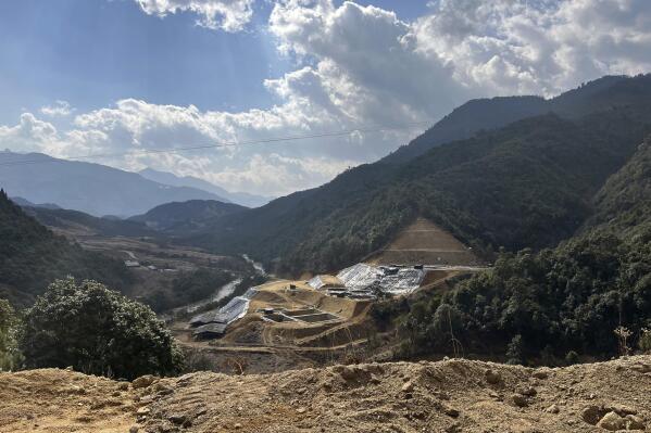 In this early 2022 photo provided by Global Witness, a new rare earth mine is dug into the side of a mountain in Pangwa, Kachin, Myanmar. The region is close to the Chinese border and the home of hundreds of rare earth mining sites. In the wake of rare earth element mining, an AP investigation has found environmental destruction, the theft of land from villagers and the funneling of money to brutal militias with links to Myanmar's secretive military government. (Global Witness via AP)