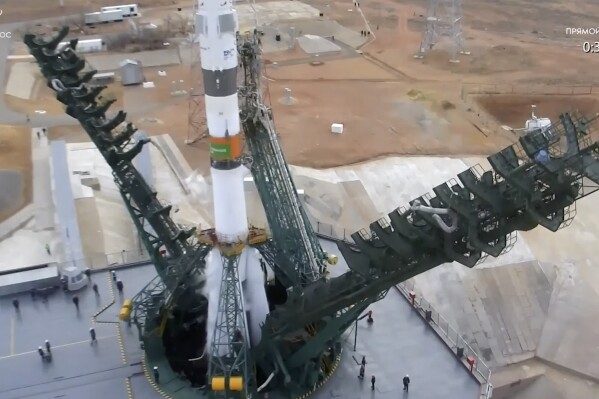 In this photo taken from video released by Roscosmos space corporation, service towers lower prior to the launch of the Soyuz 2.1a rocket with Soyuz MS-25 spacecraft carrying NASA astronaut Tracy Dyson, Oleg Novitsky of Roscosmos and Marina Vasilevskaya of Belarus to the International Space Station, ISS, at the Russian-leased Baikonur launch facility in Kazakhstan, Saturday, March 23, 2024. The crew's launch was initially scheduled for Thursday, but it was aborted by an automatic safety system about 20 seconds before the scheduled liftoff. Officials said the launch abort was triggered by a voltage drop in a power source. (Roscosmos space corporation via AP)