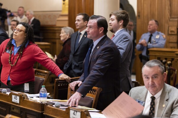 State Sen. Clint Dixon, center, R-Gwinnett, awaits voting results over Senate Bill 386, a sports betting bill, in the Senate at the Capitol in Atlanta, on Thursday, Feb. 1, 2024. (Arvin Temkar/Atlanta Journal-Constitution via AP)
