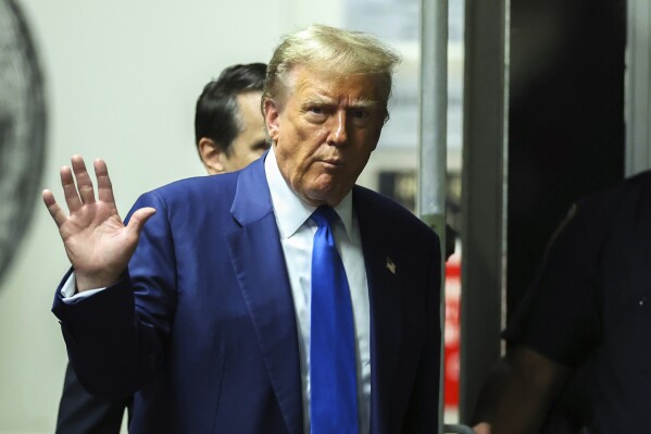 Former President Donald Trump returns to the courtroom following a break in his trial at Manhattan criminal court in New York, on Friday, May 3, 2024. (Charly Triballeau/Pool Photo via AP)