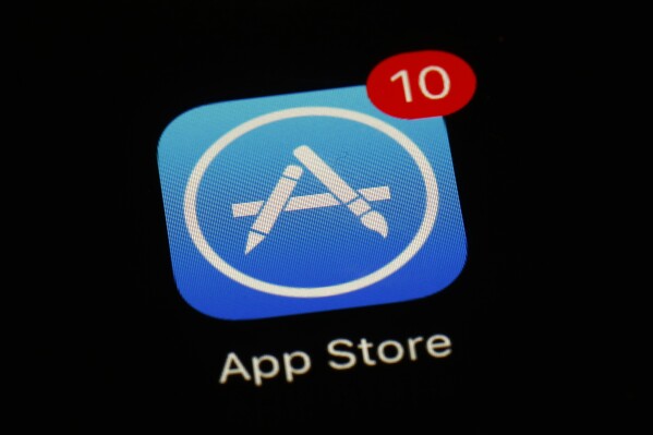 FILE - Apple's App Store icon is displayed on an iPad in Baltimore, March 19, 2018. Apple has unveiled a sweeping plan to tear down some of the competitive barriers that it has built around its lucrative iPhone franchise. The announcement Thursday, Jan. 25, 2024, comes as it moves to comply with upcoming European regulations aimed at giving consumers the choice to use alternative app stores. (AP Photo/Patrick Semansky, File)