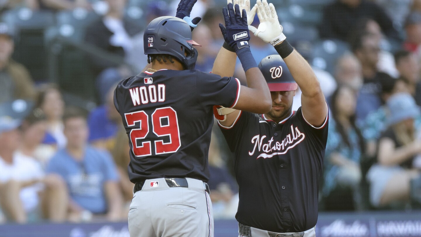 Hassell hits 1st major league homer and Nationals rout Mariners 9-0