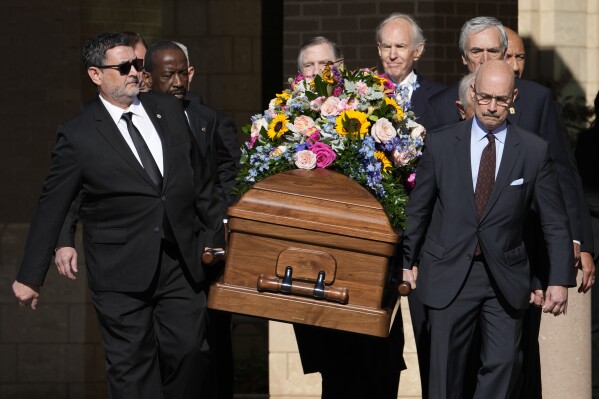 Former and current U.S. Secret Service agents carry casket of former first lady Rosalynn Carter at Phoebe Sumter Medical Center in Americus, Ga., Monday, Nov. 27, 2023. The former first lady died on Nov. 19. She was 96. (AP Photo/Alex Brandon, Pool)