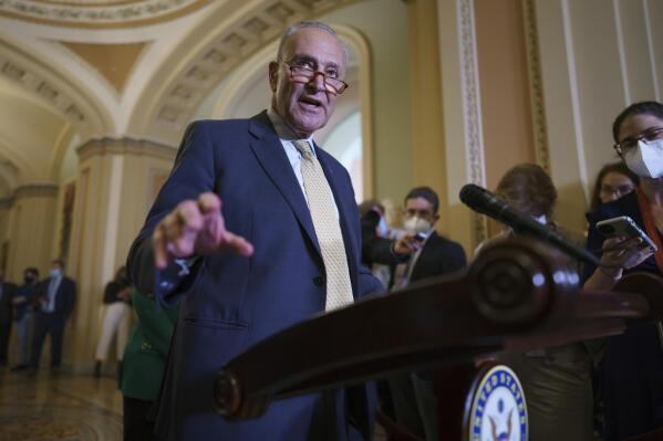 Senate Majority Leader Chuck Schumer, D-N.Y., speaks to reporters as intense negotiations continue to salvage a bipartisan infrastructure deal, at the Capitol in Washington, Tuesday, July 27, 2021. (AP Photo/J. Scott Applewhite)