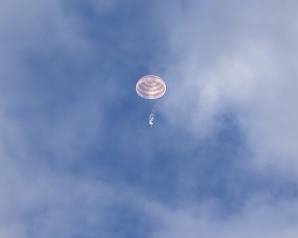 Three astronauts return to Earth after a year in space. NASA's