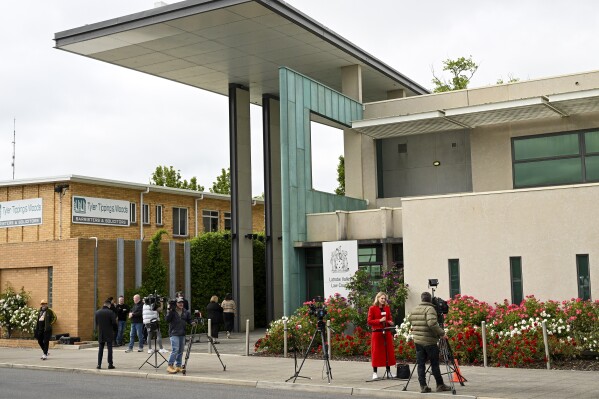 Media wait outside of the Latrobe Valley Law Courts in Morwell, Victoria, Friday, Nov. 3, 2023. Erin Patterson, 49, accused of serving her ex-husband’s parents and an aunt poisonous mushrooms with lunch appeared in a court on Friday charged with three counts of murder and five of attempted murder. (James Ross/AAP Image via AP)