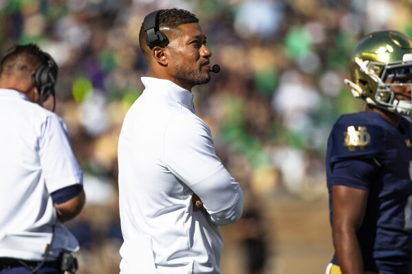 Notre Dame head coach Marcus Freeman looks to the scoreboard during an NCAA college football game against Northern Illinois, Saturday, Sept. 7, 2024, in South Bend, Ind. (AP Photo/Michael Caterina)