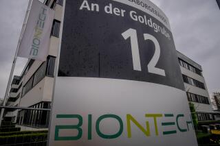 FILE - The headquarters of the German biotechnology company "BioNTech" is pictured in Mainz, Germany, March 30, 2022. BioNTech, which teamed with Pfizer to develop the first widely used COVID-19 vaccine, has reported higher revenue and net profit in the first half of the year. The German pharmaceutical company said Monday Aug. 8, 2022, that it expects demand to grow as it releases updated vaccines to target new omicron strains. (AP Photo/Michael Probst, File)