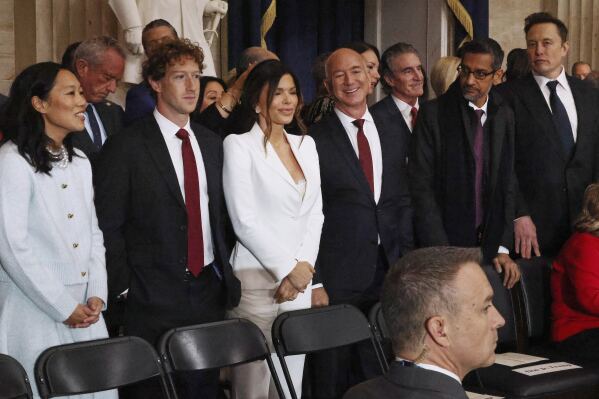 From left, Priscilla Chan, Meta CEO Mark Zuckerberg, Lauren Sanchez, Amazon founder Jeff Bezos, Google CEO Sundar Pichai and Elon Musk attend the 60th Presidential Inauguration in the Rotunda of the U.S. Capitol in Washington, Monday, Jan. 20, 2025. (Chip Somodevilla/Pool Photo via AP)