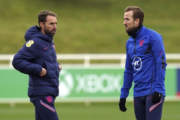 England manager Gareth Southgate talks with Harry Kane, right, during a training session ahead of the upcoming World Cup 2022 qualifying soccer match against Albania and San Marino, at St George's Park, Burton-upon-Trent, England, Tuesday, Nov. 9, 2021. (Nick Potts/PA via AP)