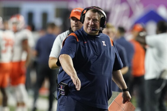 FILE - Illinois head coach Bret Bielema smiles after a touchdown during the first half of an NCAA college football game against Indiana, Friday, Sept. 2, 2022, in Bloomington, Ind. Illinois opens their season at home against Toledo on Sept. 2(AP Photo/Darron Cummings, File)