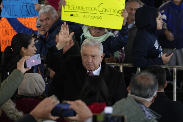 Mexican President Andrés Manuel López Obrador greets supporters as he arrives to a ceremony to inaugurate a 